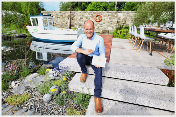 Designer Andrew Christopher Dunne, The Sustainable Seafood Garden, Gold Medal Winner and Overall Show Garden Winner at Bord Bia's Bloom 2018. Following a rigorous two-day judging process with an independent panel of expert judges, the award was announced as Bord Bia opened the gates on the 12th annual Bloom festival in the Phoenix Park, Dublin. The Sustainable Seafood Garden tells the story of the journey from tide to table, of the fish and seafood that surround and inhabit this island. It boasts a large water feature with shimmering fish sculptures and an ÔupcycledÕ fishing boat which doubles as a kitchen. Throughout the weekend, the boat will host cookery demonstrations featuring sustainably sourced seafood. Bord Bia's Bloom takes place in the Phoenix Park from May 31st to June 4th. Photo Fennell Photography