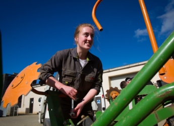 A student doing machinery work