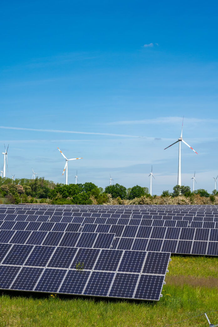 solar-power-panels-with-wind-turbines-A5UUTG3